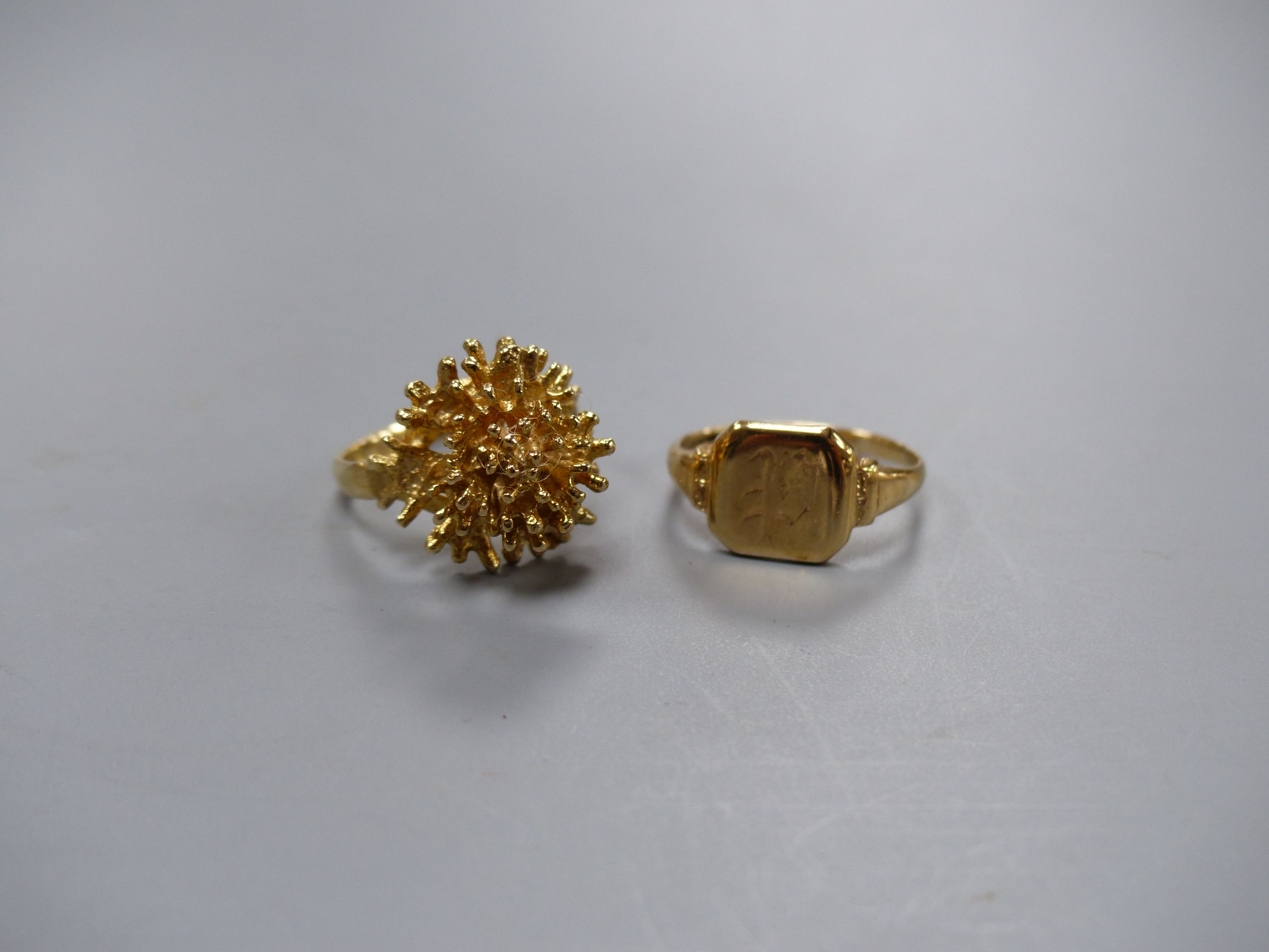 A modernist 9ct yellow gold formed as a coral branch cluster and a 9ct yellow gold signet ring 6.3g